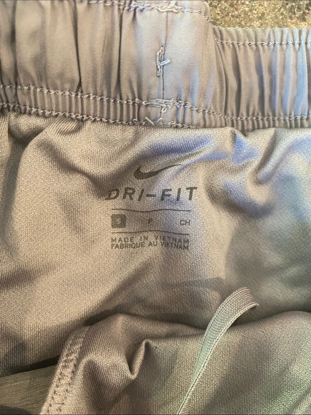 Nike Women's Light Gray Athletic Running Shorts with White Swoosh